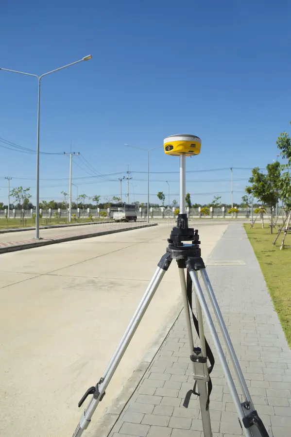 Multi-band geodetic GNSS base station and RTK rover on tripod